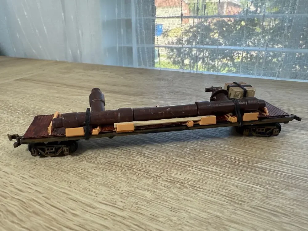 Vintage Toy Train Flatcar with Cannon Style Barrel Load Wood Tone Model Railroad